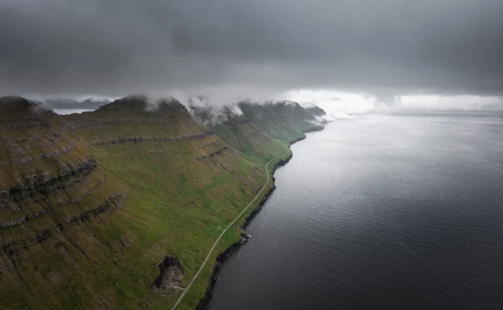 Mountain peak on Kalsoy Island, Faroe Islands – green slopes and sea