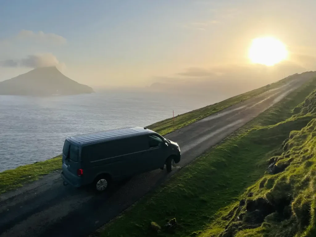 Camper van parked at sunset on the Faroe Islands