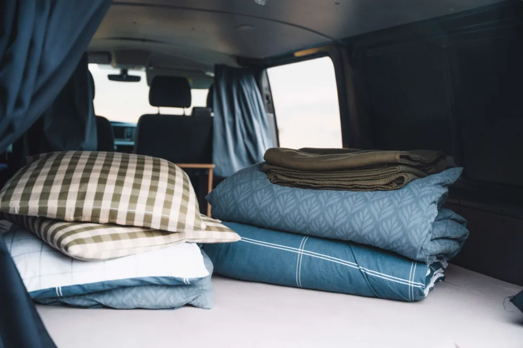 Blankets and duvets inside camper van rental, Faroe Islands road-trip