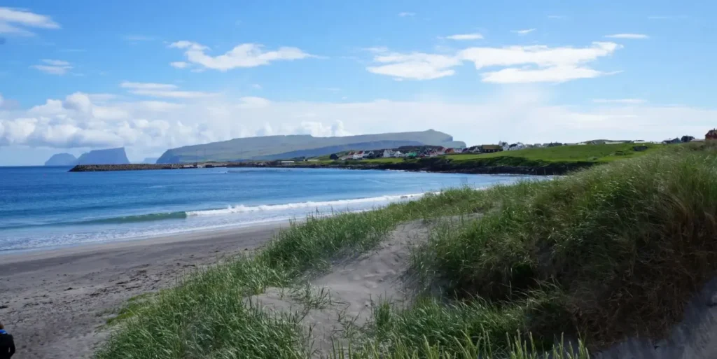 Sandur village and sand dunes on Sandoy island, Faroe Islands beach
