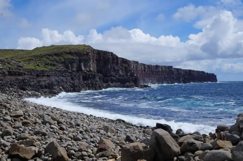 Søltuvík west coast Sandoy – dramatic sea cliffs and pebble beach, Faroe Islands