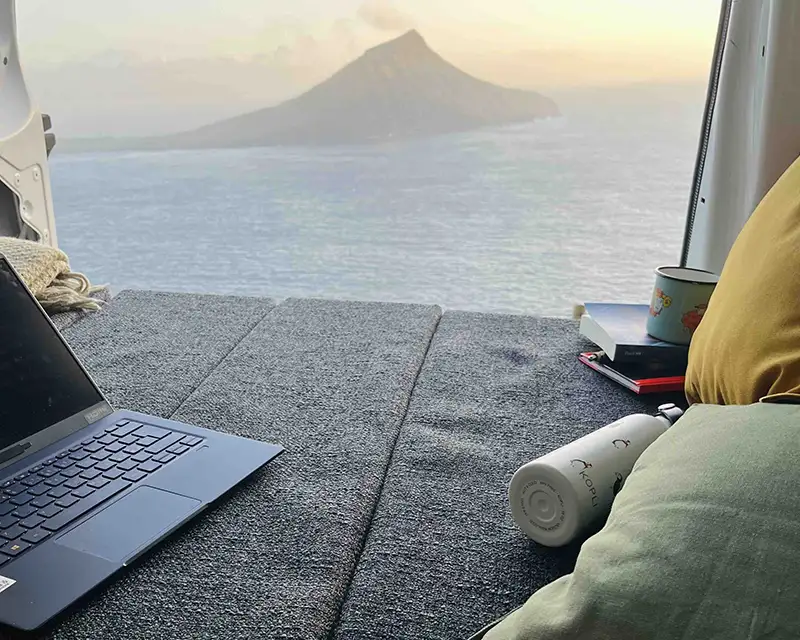 Campervan interior with ocean and mountain view in the Faroe Islands