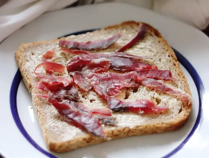 Skerpikjot-e1733146795153 Traditional Faroese dried mutton (skerpikjøt) served on bread
