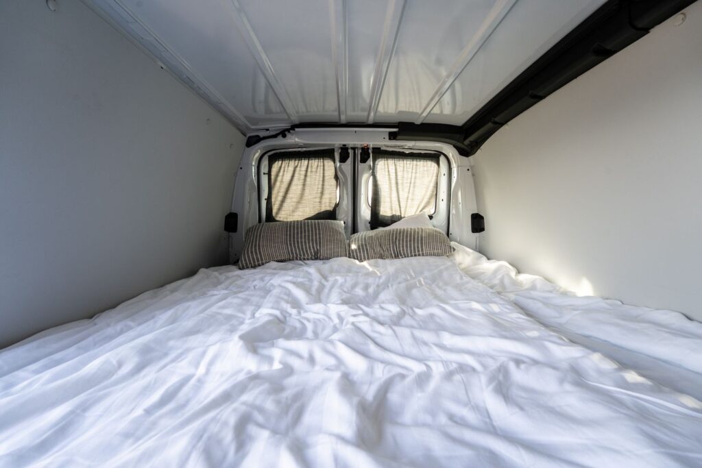 Bed setup inside a campervan in the Faroe Islands